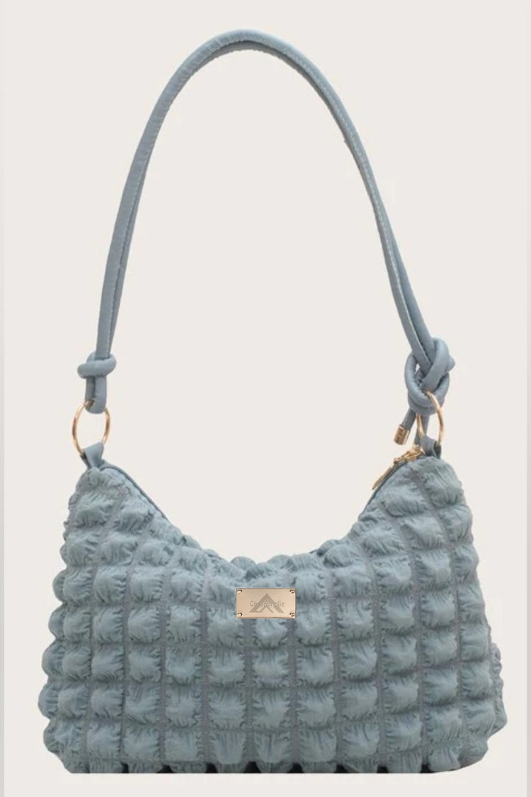 "Gathered Handbag" with our patented metal Label on it