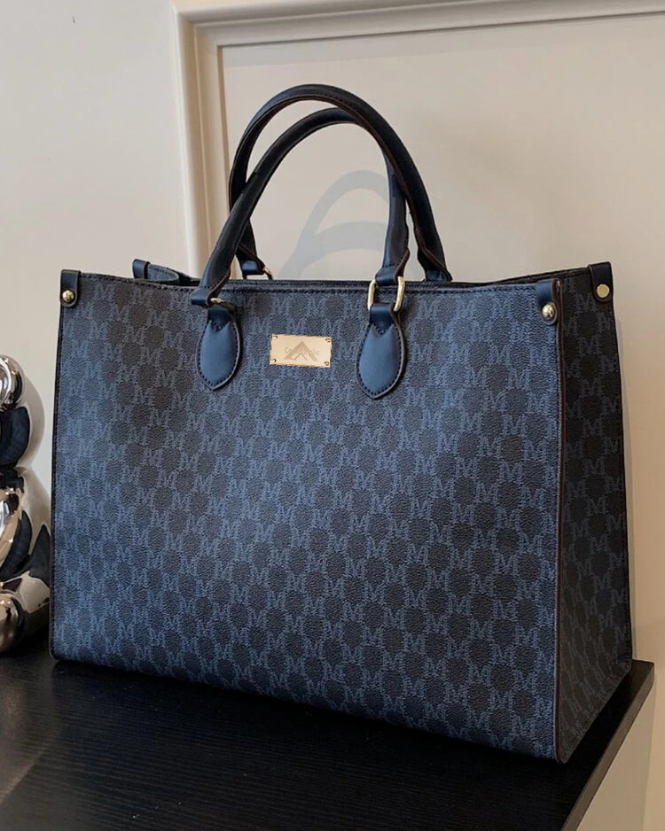 "Elegant Bag with Letter Graphic"