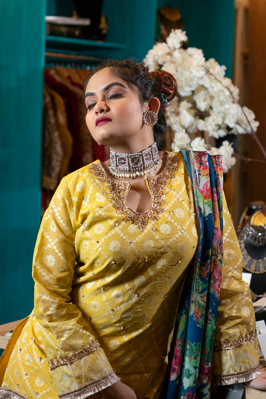 woman in yellow long sleeve shirt wearing gold crown