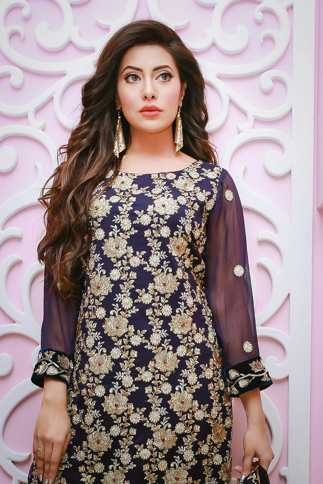 woman in black and white floral dress