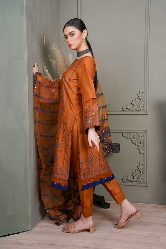 a woman standing in front of a wall