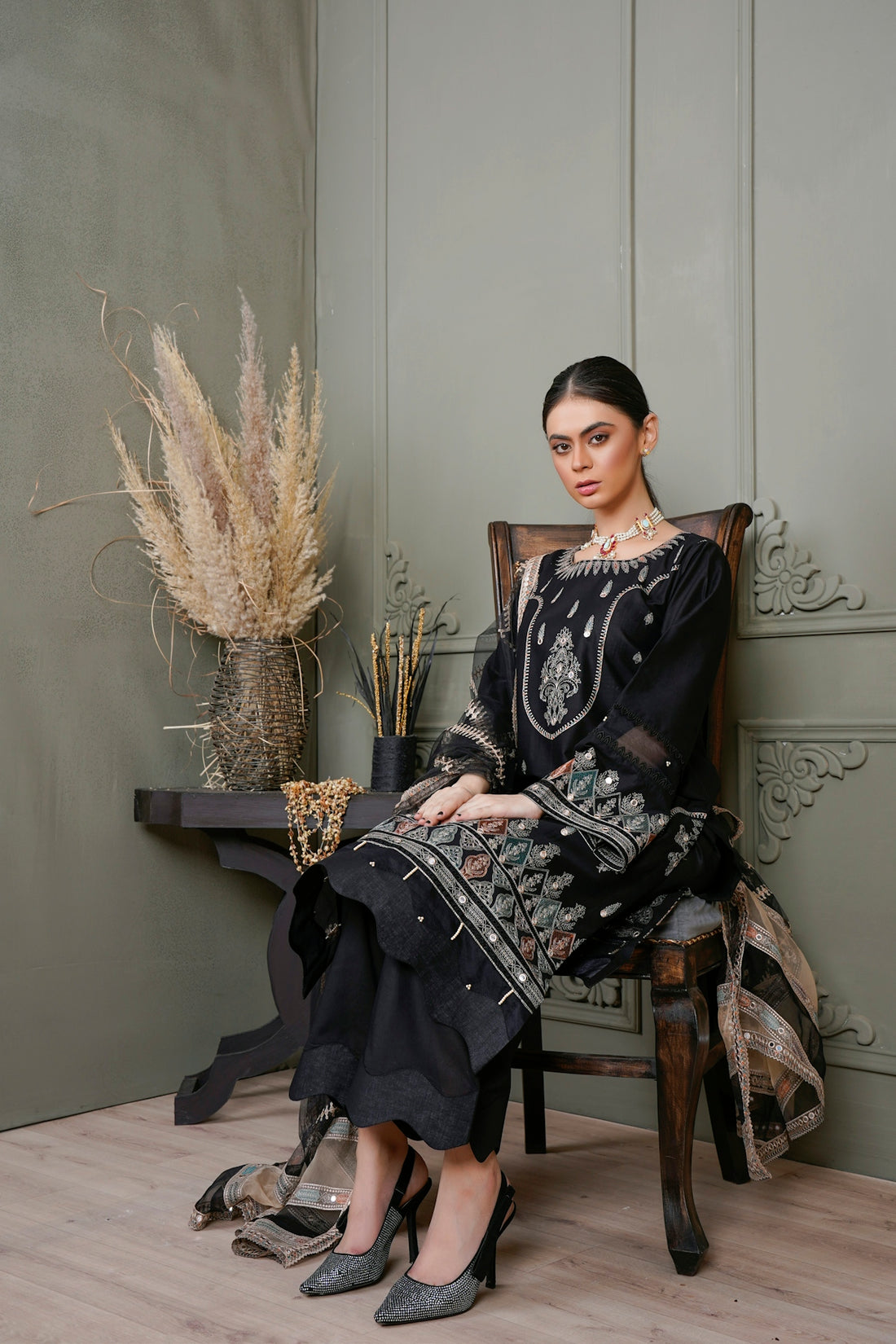 a woman sitting on a chair in a room