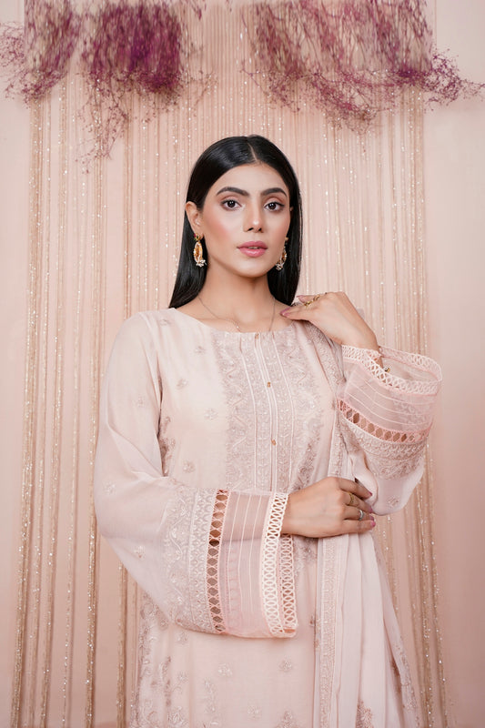 a woman standing in front of a curtain