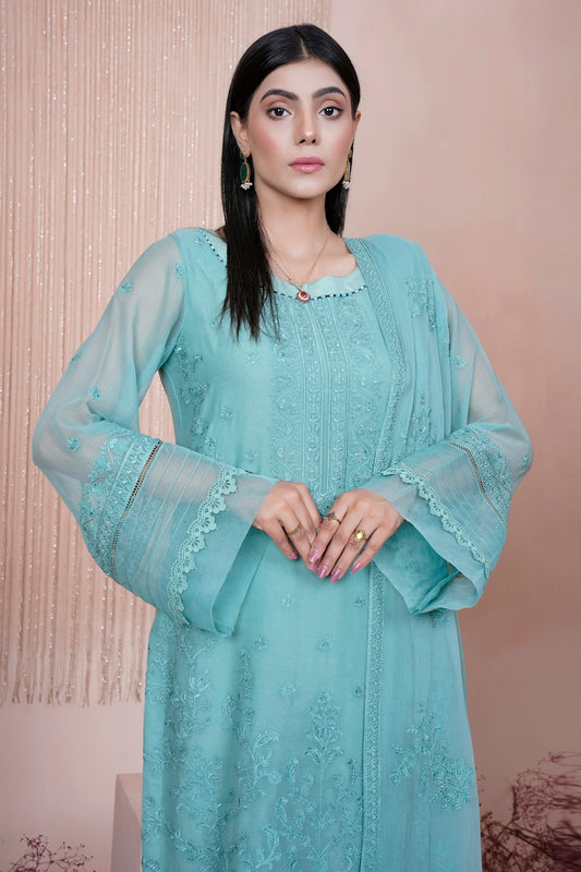a woman in a blue dress posing for a picture