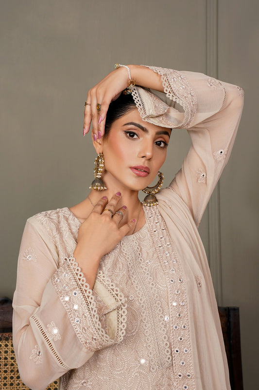 a woman in a white outfit posing for a picture