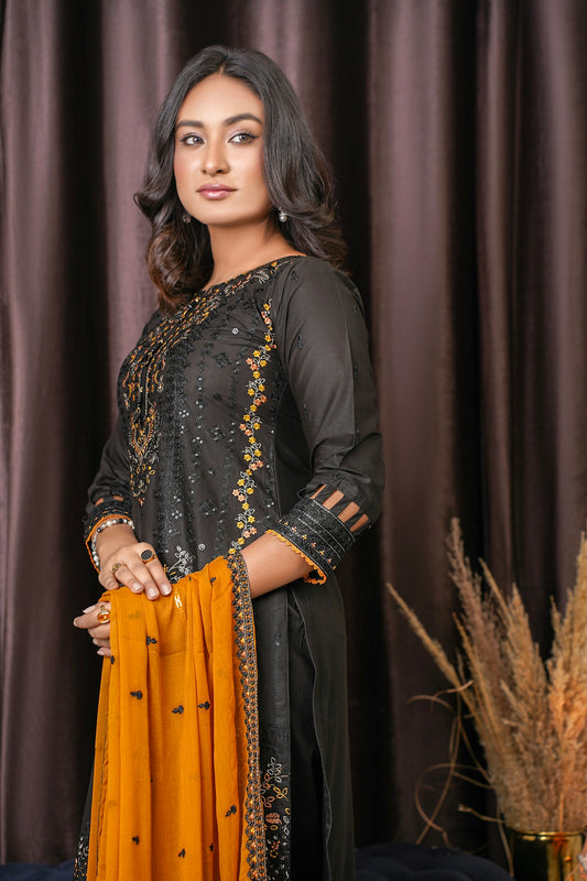 a woman standing in front of a curtain