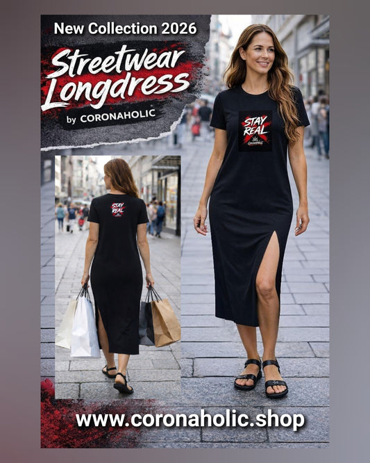 Woman wearing black streetwear longdress with “Stay Real” print, walking in city with shopping bags
