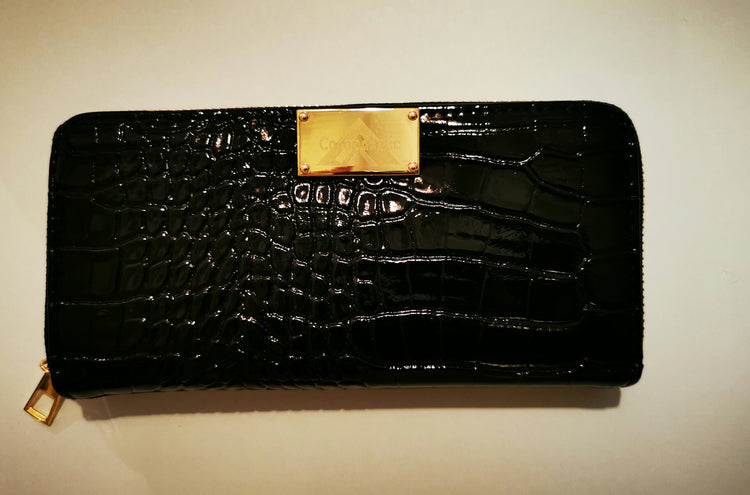 "Crocodile Wallets" 

with our patented metal Label on it